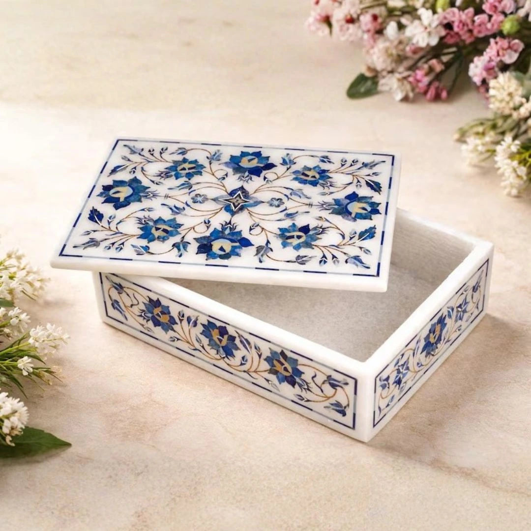 Handcrafted white marble jewelry box with blue floral inlay design and removable lid.