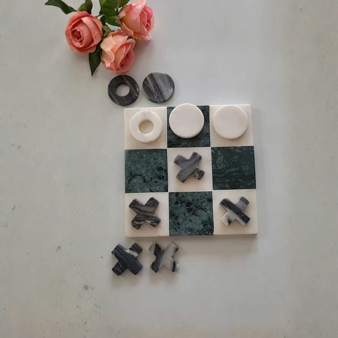 Minimalist stone tic-tac-toe game made from natural marble