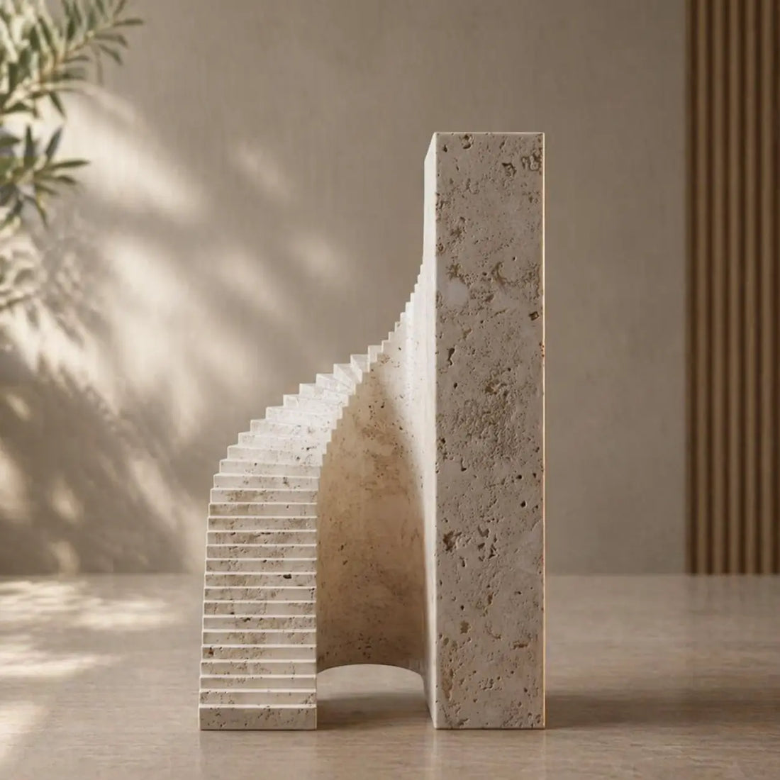 A modern minimalist bookend made of textured travertine marble