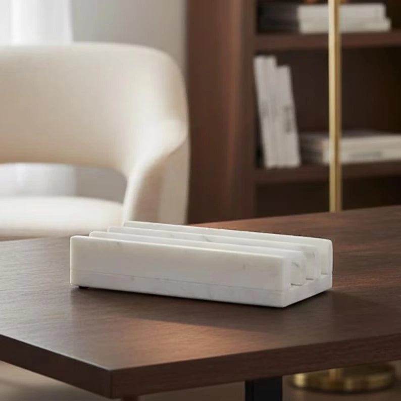 White marble desk organizer featuring three evenly spaced slots in a rectangular block design on a neutral background.